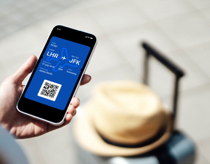 mobile phone showing an airline boarding pass on the screen